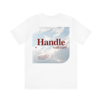 Handle with Care. This classic unisex jersey short sleeve tee fits like a well-loved favorite. Soft cotton and quality print will make you fall in love with it over and over again. Made from a lightweight fabric that is easy to layer and is breathable. Perfect for active and leisure wear.